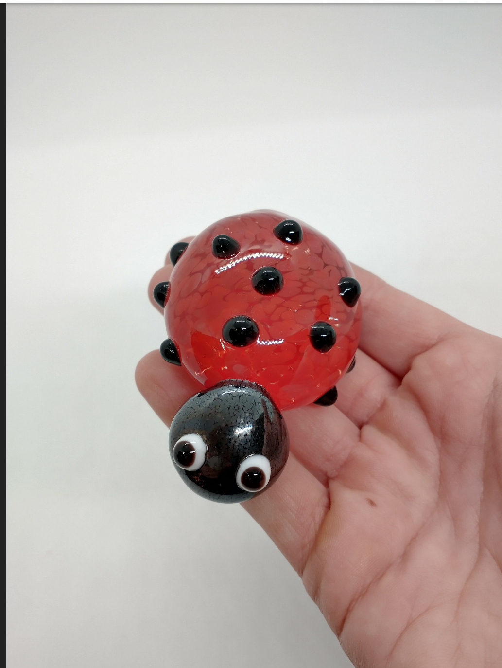 TWO glass lady bugs